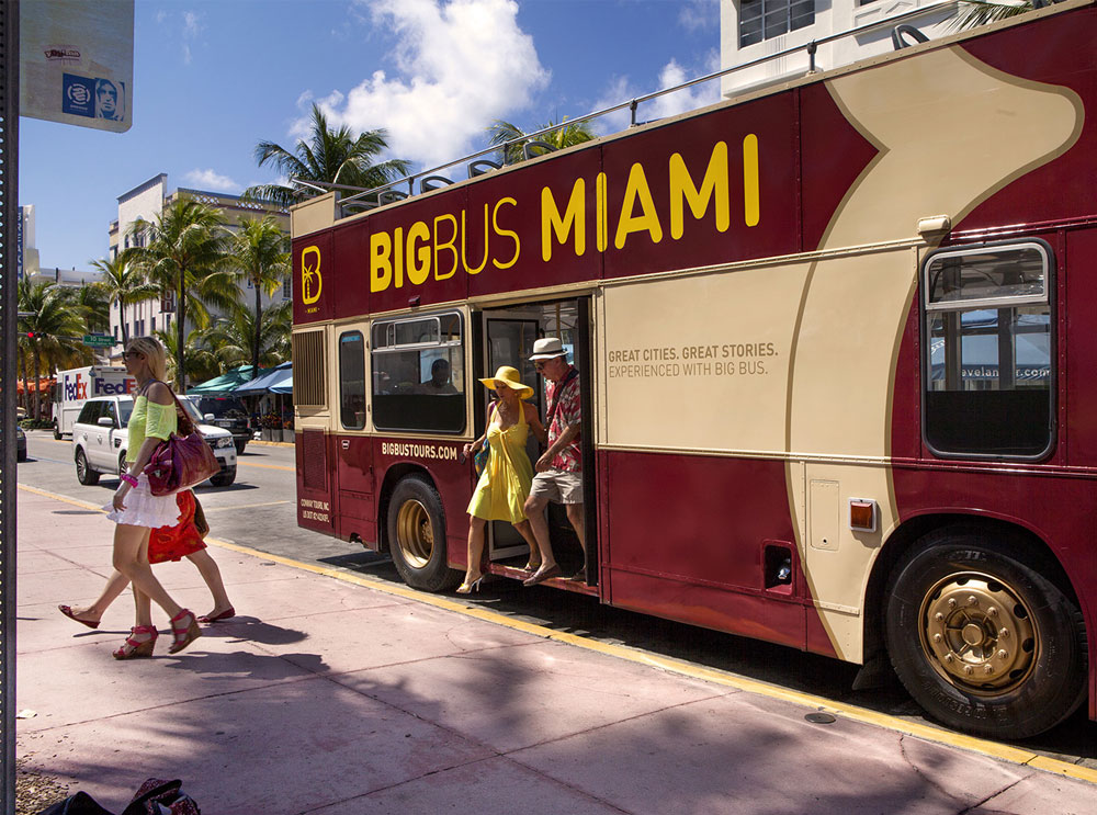 Customers hopping off a Big Bus sightseeing tour