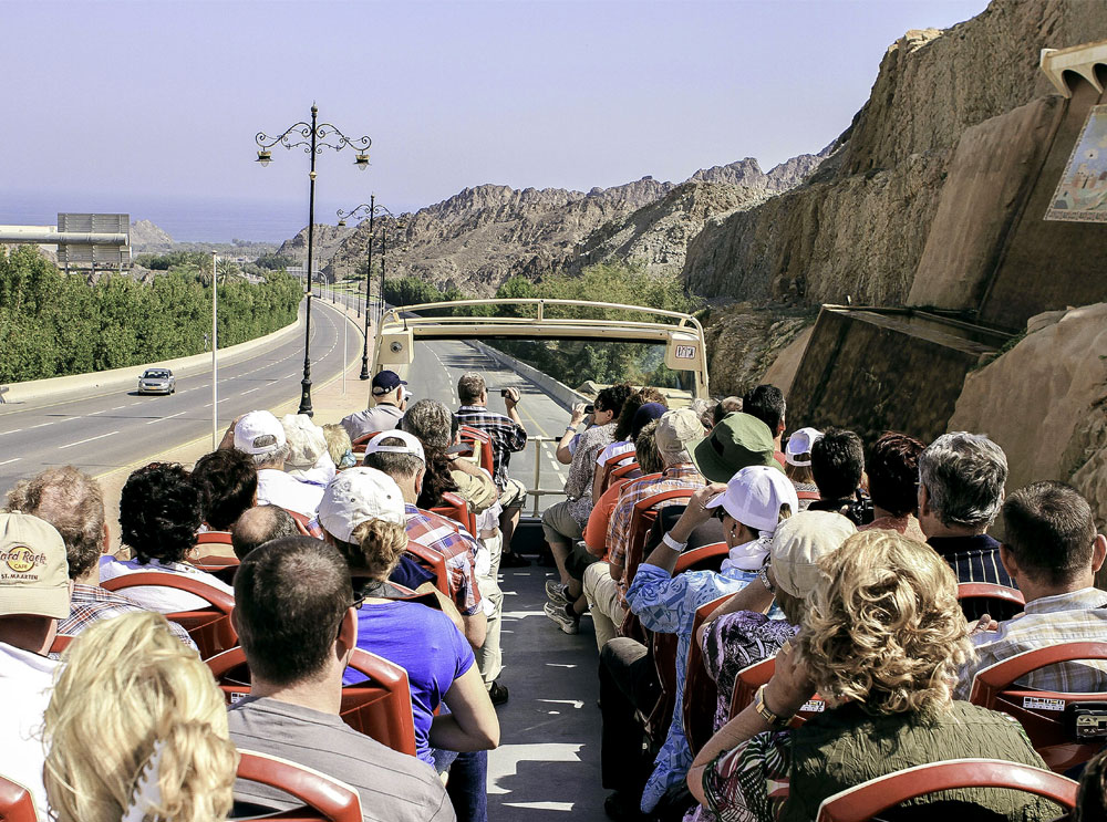 Passengers on top deck of bus tour