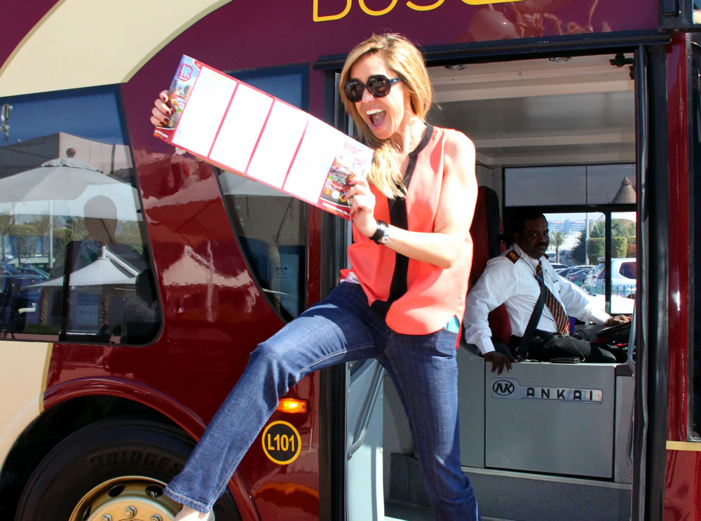 Woman hopping of a Big Bus Tour