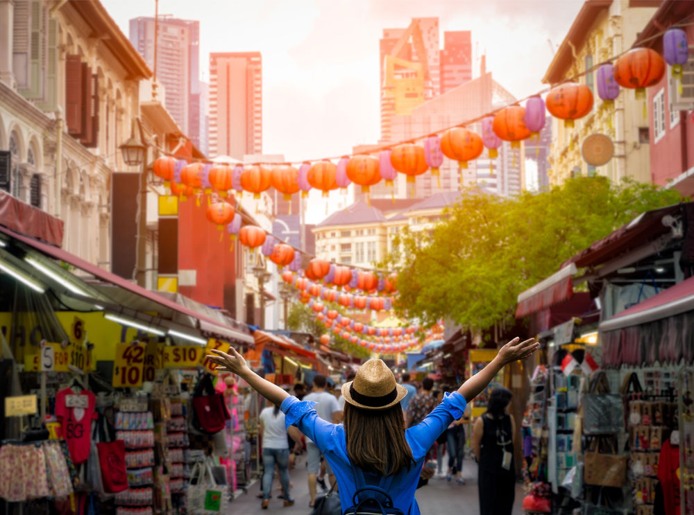 Woman in Singapore with her arms to the side