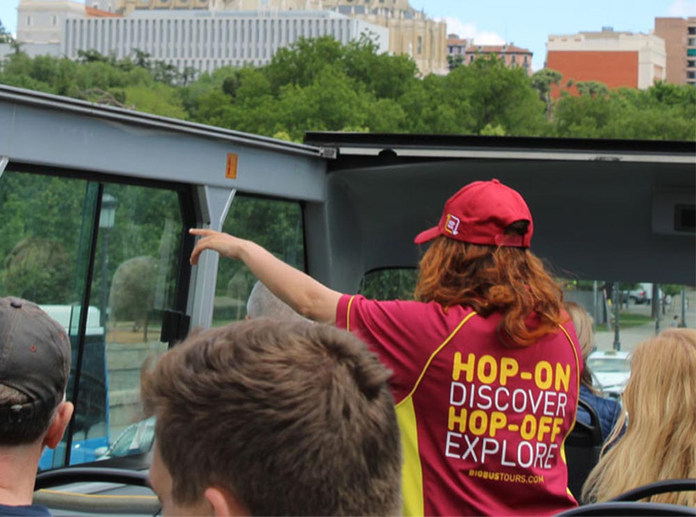 Live guide on top deck of bus tour