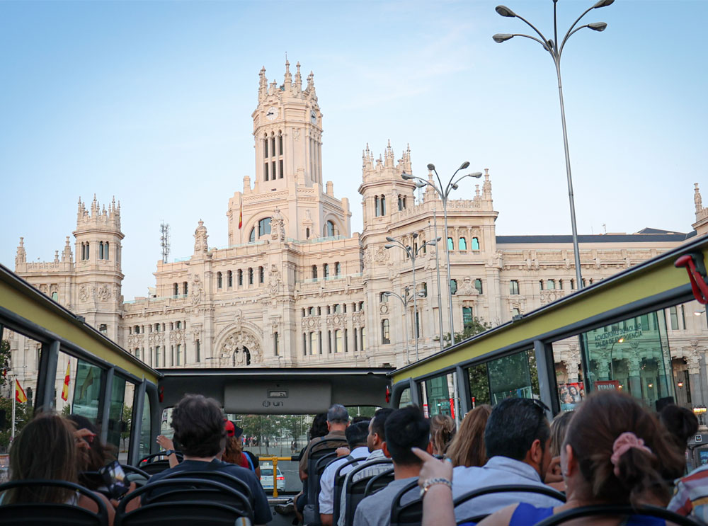 Passengers on top deck of a bus tour