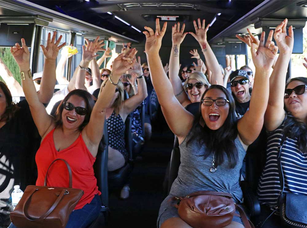 Passengers having fun on the TMZ tour bus. 