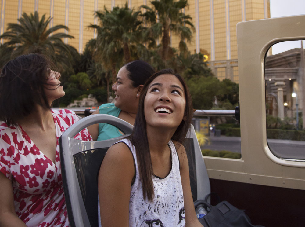 Woman on top deck of bus tour