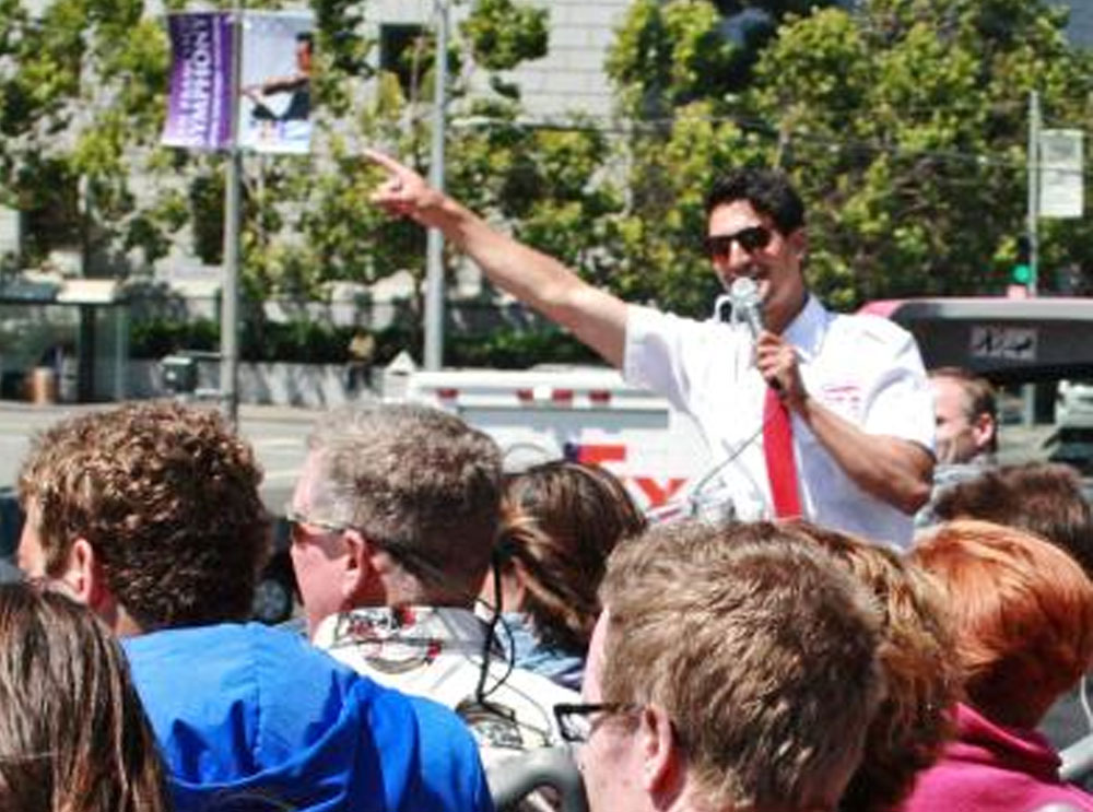 Live guide on top deck on sightseeing tour