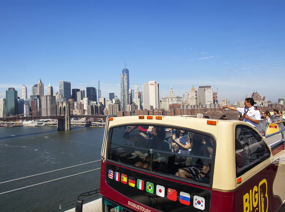 Big Bus Tour in New York passing over a bridge
