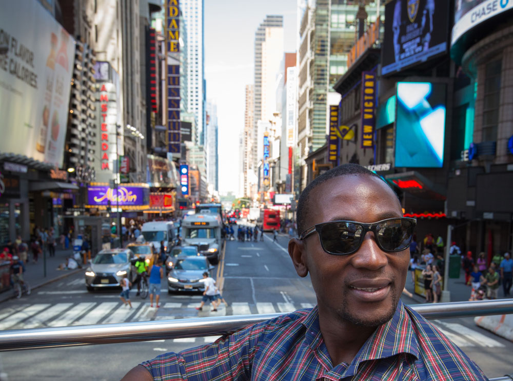 Man on sightseeing bus tour in New York
