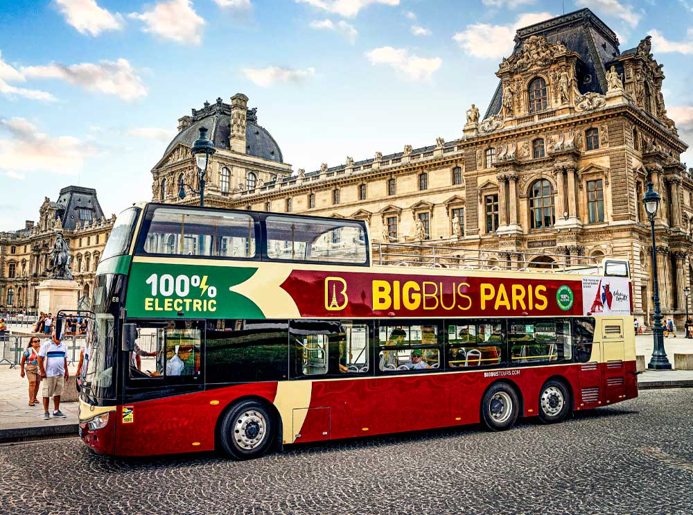 Big Bus Tours Paris stopped outside the Louvre.