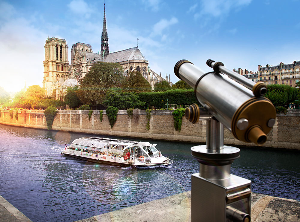 Boat cruise passing the Notre Dame on the River Seine