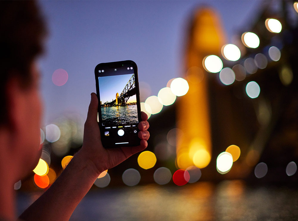 Passenger taking a photo of the Sydney Habour Bridge