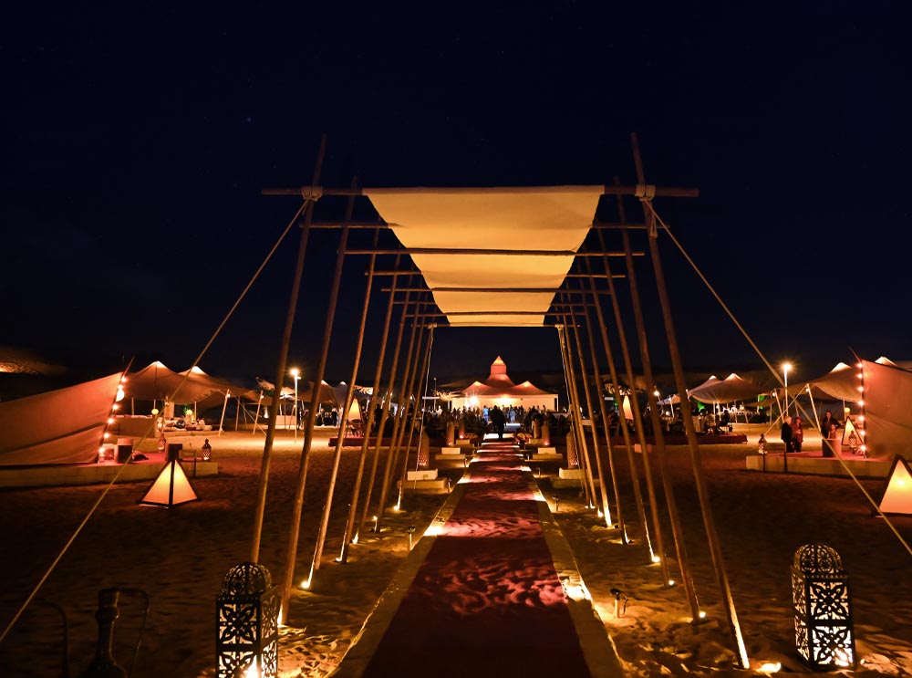 The Caravanserai Desert Camp entrance at night