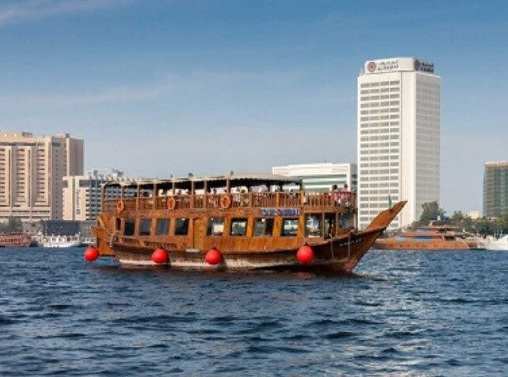 A Dhow sails along Dubai Creek