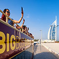 Big Bus Tours Dubai Group of people on the bus taking photos of Burj Al arab
