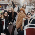 Group of friends on the top deck of a Big Bus London Tour
