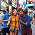 Friends taking selfies in Times Square