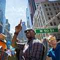 Man pointing from Big Bus Tours New York