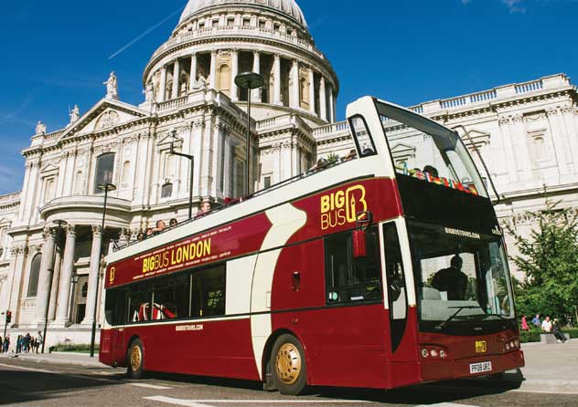 Big Bus Tours London passes in front of St. Paul's Cathedral in London