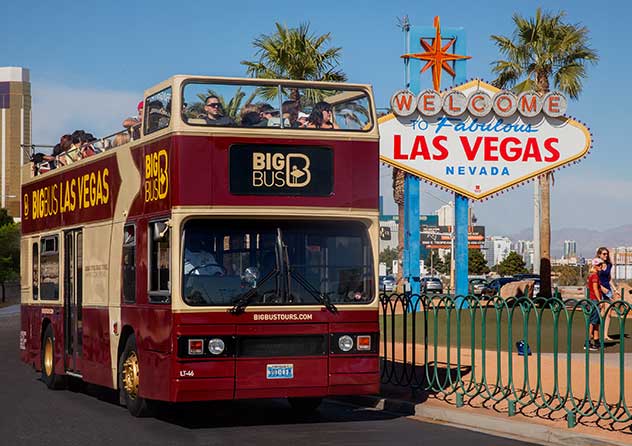 Big Bus Tours Las Vegas beside the Welcome to Fabulous Las Vegas Sign