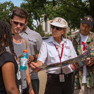 Tour guide helping a group of tourists