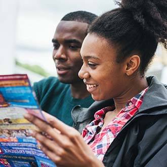 Couple looking at Philadelphia bus map