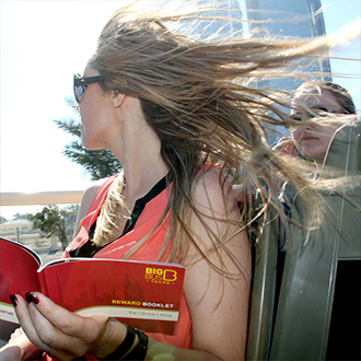 Woman on Big Bus Abu Dhabi open-top sightseeing tour