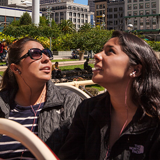 People on an open-top bus