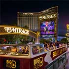 Big Bus Tours Las Vegas passing the Mirage Resort at night