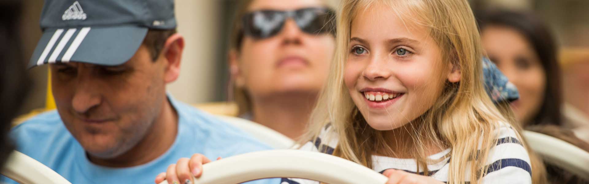 Little Girl on top deck of a Big Bus Tour