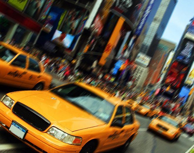 Yellow taxis driving through NYC